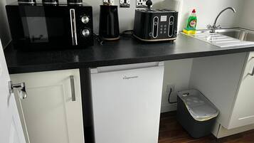 Fridge, microwave, toaster, cookware/dishes/utensils