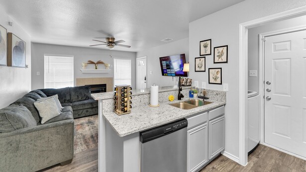 A compact living space with a kitchen, a dining area, and a living room.