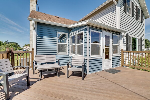 A blue house with a deck, a chimney, and a door. - Peaceful Merrillan Autumn & Winter Getaway (Merrillan)