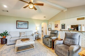 A living room with a ceiling fan, a sofa, a recliner, a coffee table, and a fireplace. - Boqsue River Valley Views! 3-acre Country Home (Valley Mills)