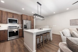 Fridge, microwave, oven, stovetop - New spacious 3 bedroom, private deck, forest view and garage parking (Fraser)