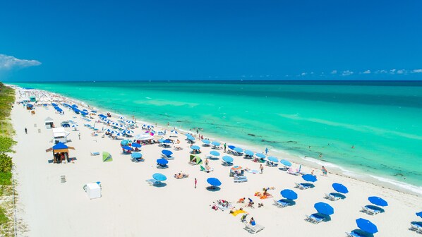 On the beach, sun loungers, beach towels