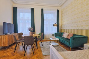 Classic Apartment | Living area | 125-cm Smart TV with satellite channels