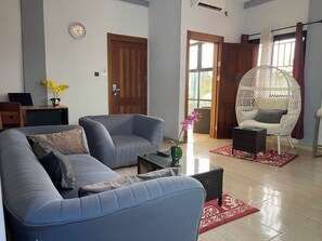 Senior Suite, City View | Living area | 80-inch Smart TV with satellite channels, MP3 dock