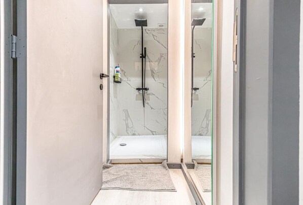 Shower, hair dryer, towels, soap