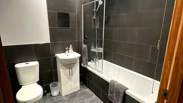 Shower, towels, soap, toilet paper