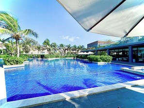 Outdoor pool, open 6:00 AM to 6:00 PM, pool umbrellas, sun loungers