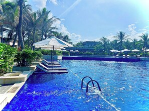 Outdoor pool, open 6:00 AM to 6:00 PM, pool umbrellas, pool loungers