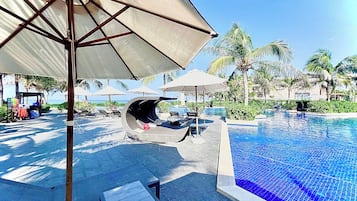 Outdoor pool, open 6:00 AM to 6:00 PM, pool umbrellas, sun loungers