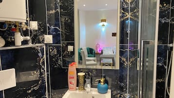 Shower, towels, soap, toilet paper