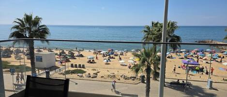 On the beach, sun-loungers