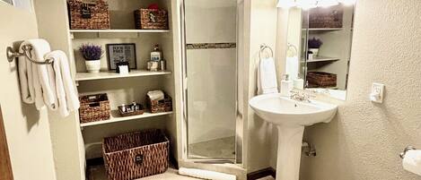 Shower, hair dryer, towels, soap