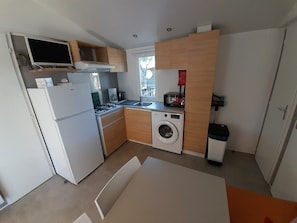 Fridge, microwave, stovetop, coffee/tea maker