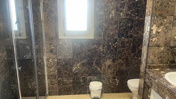Shower, hair dryer, towels, soap