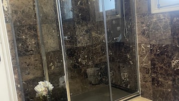 Shower, hair dryer, towels, soap