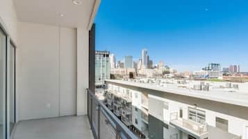 A high-rise building with a clear view of the city skyline.
