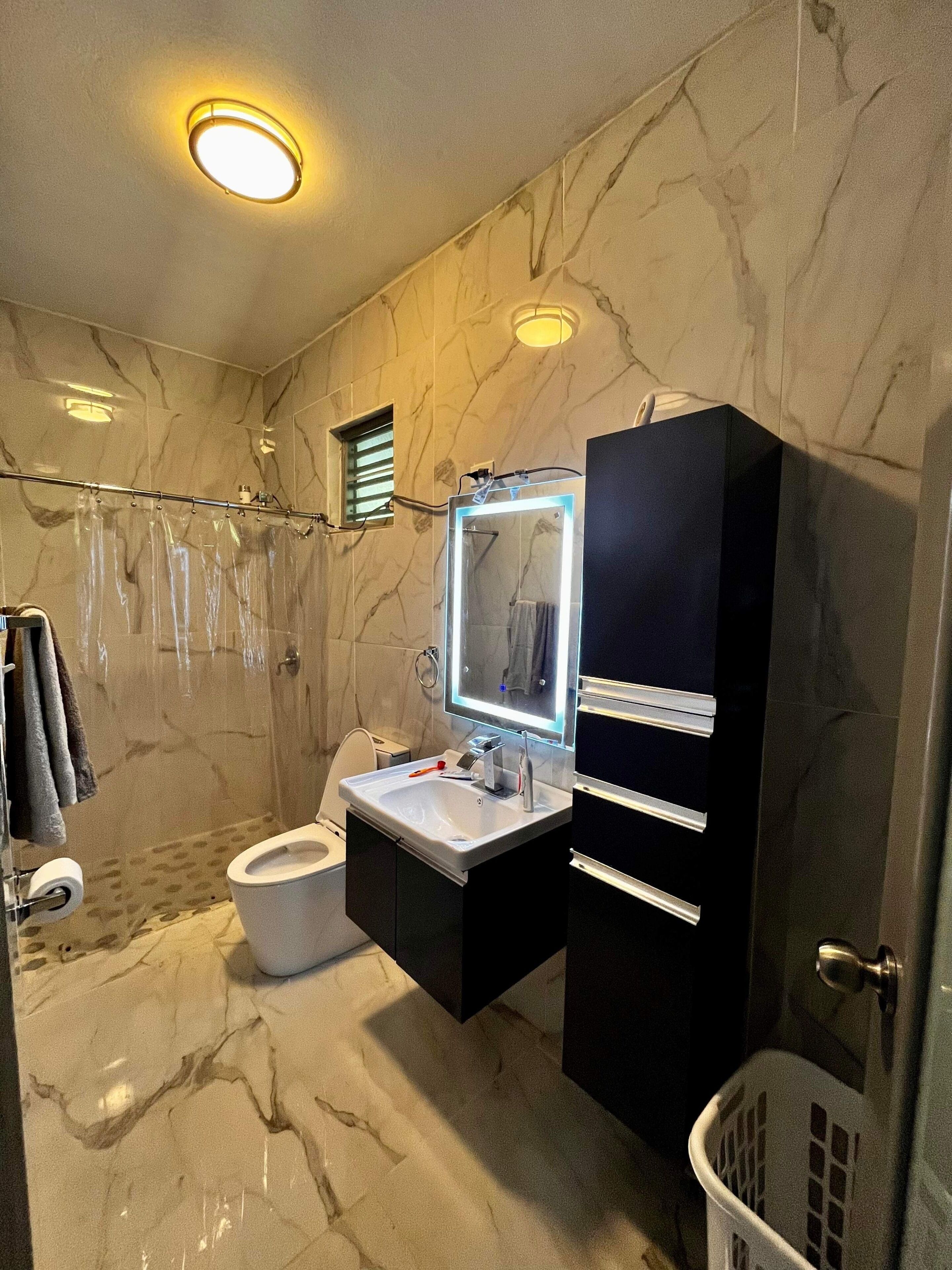 Shower, towels, soap, toilet paper