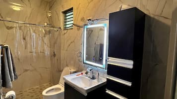 Shower, towels, soap, toilet paper