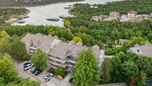 A residential area with a river, dock facilities, and houses with balconies.
