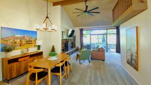 A spacious living area with a dining table, chairs, a sofa, and a ceiling fan. - Mountain View Retreat ~Deck +grill! ~Jacuzzi Tub! (Flagstaff)