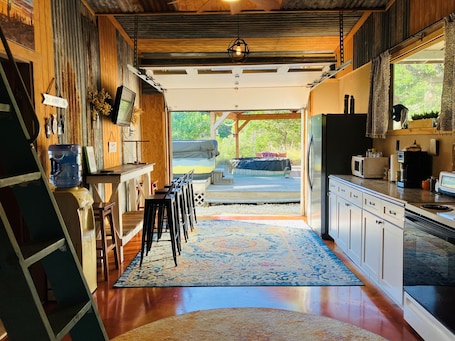 Fridge, microwave, oven, stovetop. Tiny cabin/guest house with hot tub and pool surrounded by nature