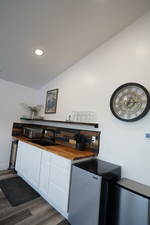 Fridge, coffee/tea maker, cookware/dishes/utensils