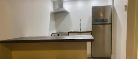 Appartement supérieur, 2 grands lits, cuisine | Cuisine privée | Micro-ondes dans les aires communes