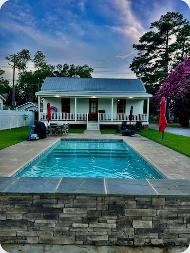 Charming 1-bedroom historical cottage in serene Marksville with heated pool.