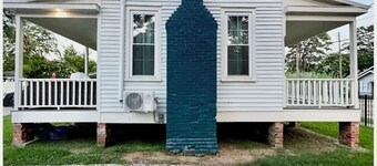 Charming 1-bedroom historical cottage in serene Marksville with AC and pool.
