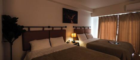 Family Room, Balcony, City View | Laptop workspace, blackout drapes, iron/ironing board, free WiFi