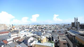A densely packed urban area with numerous buildings and a clear sky.
