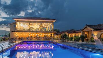 Outdoor pool, open 7:00 AM to 10:00 PM, pool umbrellas, sun loungers