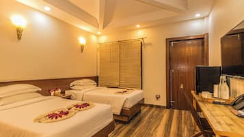 Family Twin Room, Garden View | In-room safe, desk, laptop workspace, blackout curtains