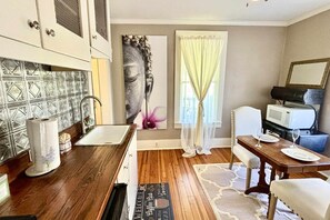 Microwave, coffee/tea maker, dining tables