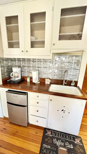 Microwave, coffee/tea maker, dining tables