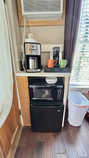 Microwave, coffee/tea maker, dining tables