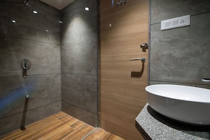 Separate tub and shower, hair dryer, slippers, towels