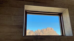 A window with a view of rocky mountains. - Ten Bits Ranch - Room # 20 - Law Office (Terlingua)