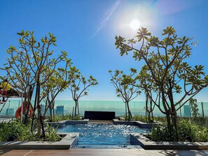 Outdoor pool, open 7:00 AM to 7:00 PM, pool umbrellas, sun loungers