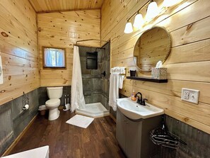 Shower, hair dryer, towels, toilet paper