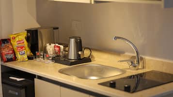 Mini-fridge, microwave, stovetop, cookware/dishes/utensils