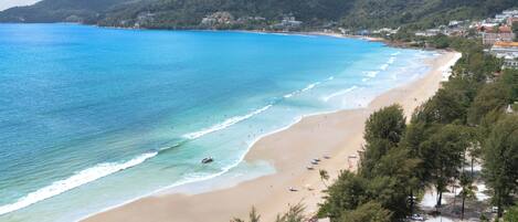 On the beach, sun loungers, beach towels