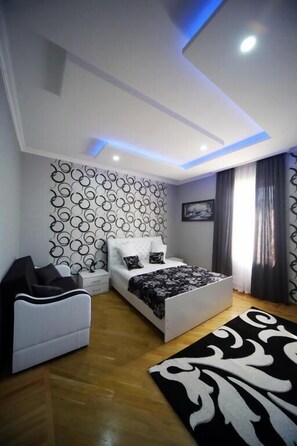 Suite, Balcony, Garden View | Blackout drapes, soundproofing, iron/ironing board, free WiFi