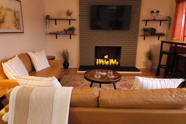 Fireplace in living room (non functional) filled with battery powered candles