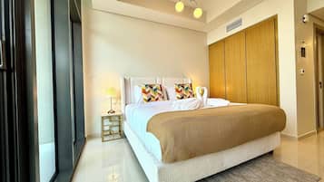 Superior Studio Suite, City View | In-room safe, desk, laptop workspace, iron/ironing board