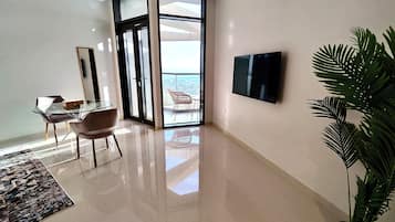 Superior Studio Suite, City View | In-room safe, desk, laptop workspace, iron/ironing board