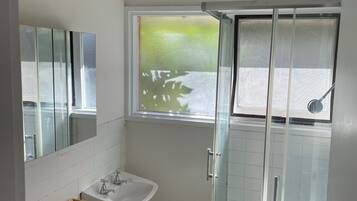 Shower, hair dryer, towels, toilet paper