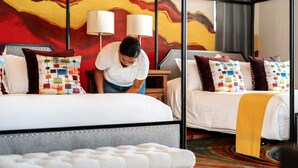A hotel room with a four-poster bed, a matching four-poster bed, and a bench. - Cabo Villa for 20 w Ocean Views Pool Hot tub (San José del Cabo)