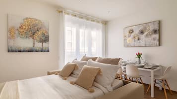 1 bedroom, desk, iron/ironing board, travel crib