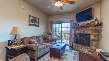 TV connectée, cheminée, lecteur de DVD, vidéothÚque